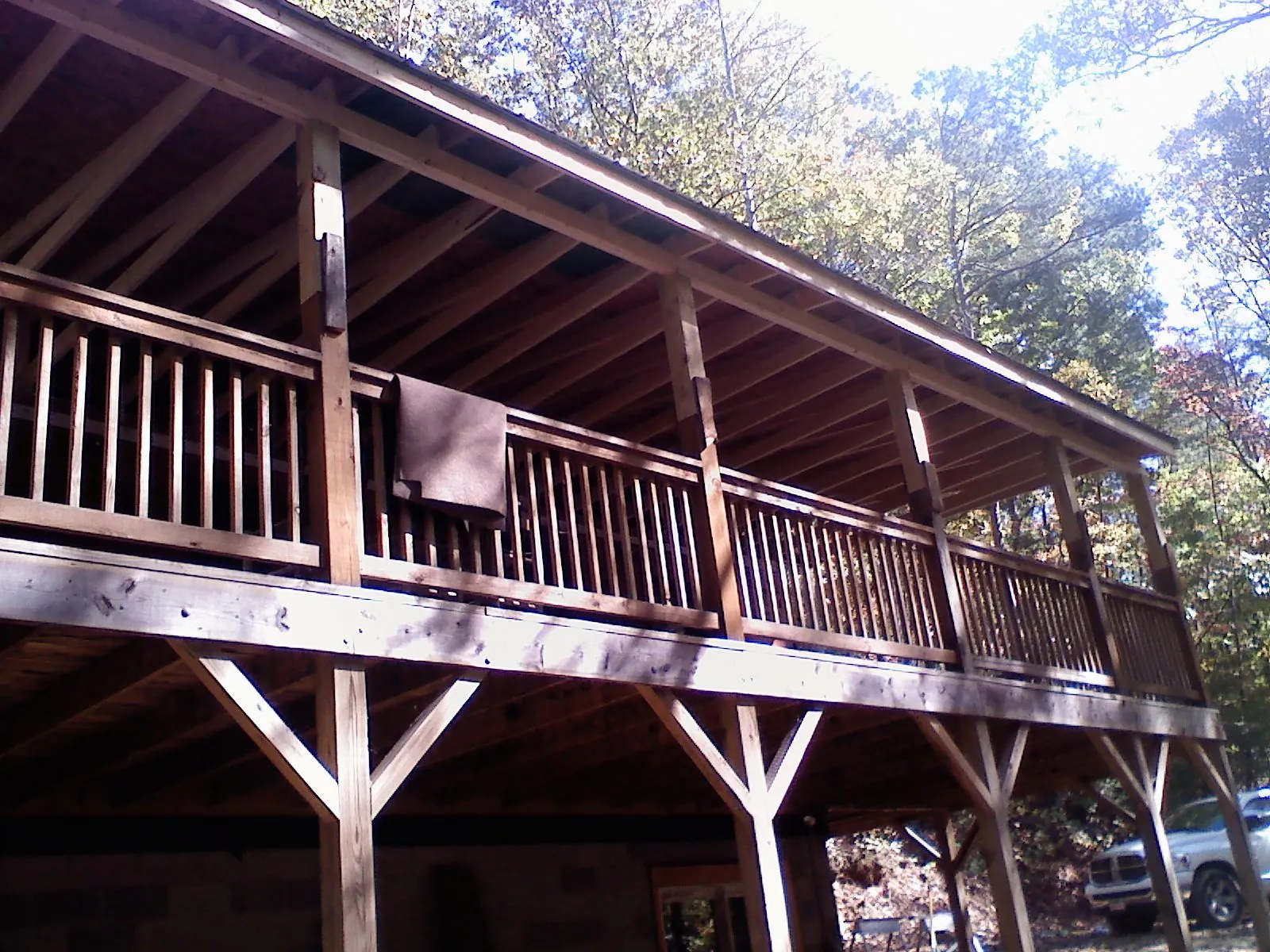 Timber framing under a new elevated porch and deck — Roof Leak Repair in Bond by Roofing Brothers